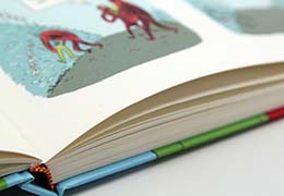 Uncoated off-white paper stock gives a unique, raw feel.